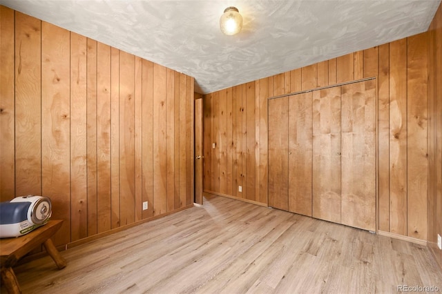 29 Deerfield Ln, Florissant, CO 80816 - spare room with wood finished floors, wood walls, and baseboards