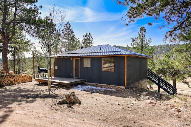 29 Deerfield Ln, Florissant, CO 80816 - back of house with a deck, metal roof, and stairs