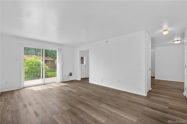 1235 S Benton St, Lakewood, CO 80232 - spare room featuring wood finished floors and baseboards