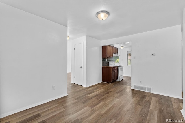 1235 S Benton St, Lakewood, CO 80232 - unfurnished living room featuring wood finished floors