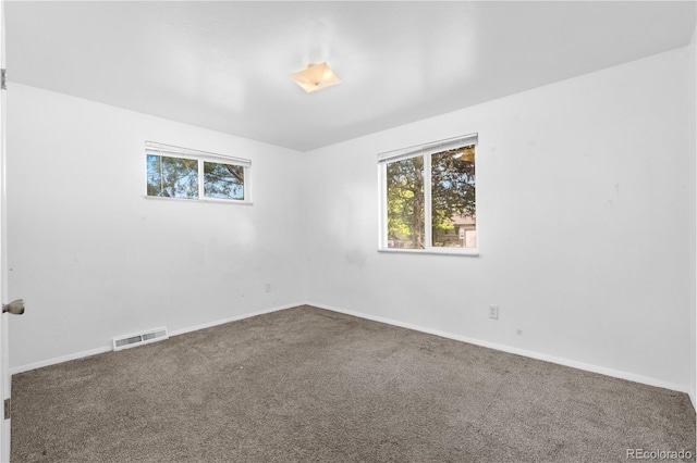 1235 S Benton St, Lakewood, CO 80232 - carpeted spare room featuring plenty of natural light