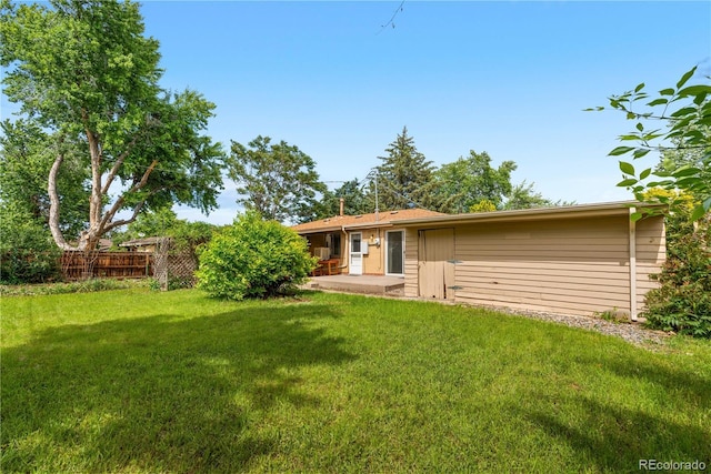 1235 S Benton St, Lakewood, CO 80232 - rear view of house featuring a patio
