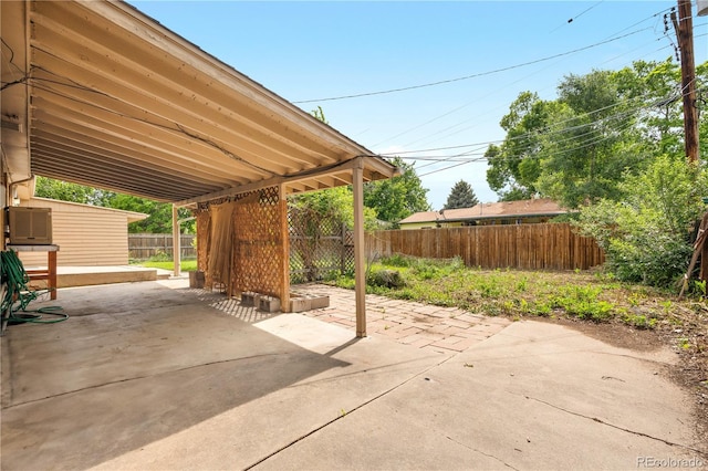 1235 S Benton St, Lakewood, CO 80232 - fenced backyard featuring a patio area