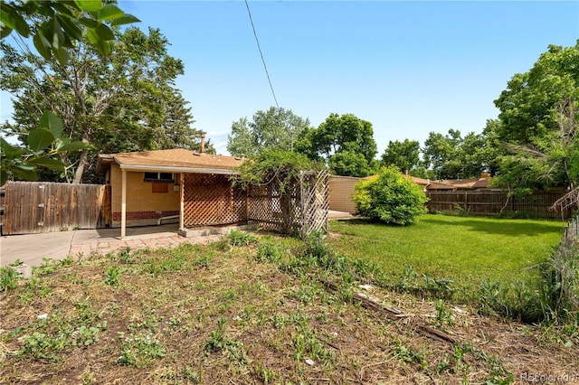 1235 S Benton St, Lakewood, CO 80232 - fenced backyard with a patio
