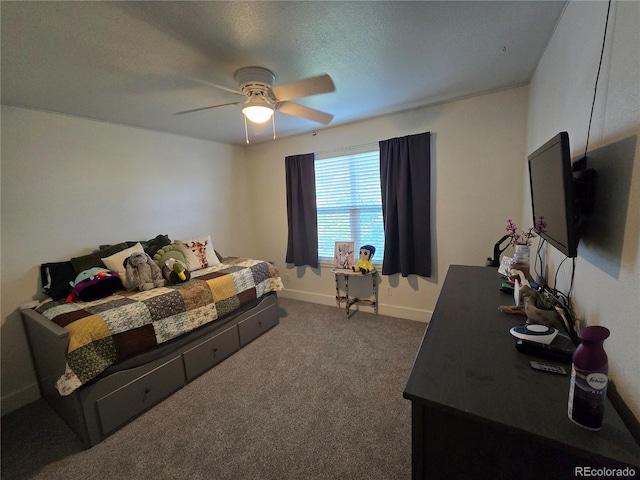 bedroom with ceiling fan, dark carpet, and a textured ceiling