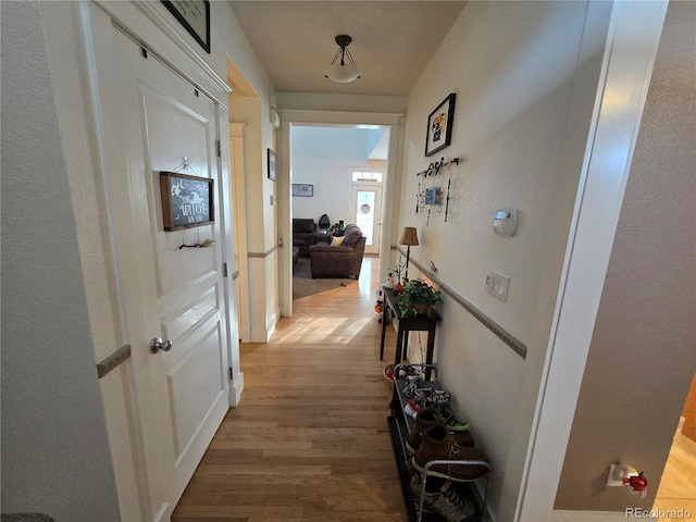 hallway with light wood-type flooring