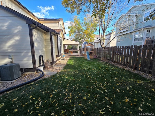 view of yard featuring central air condition unit