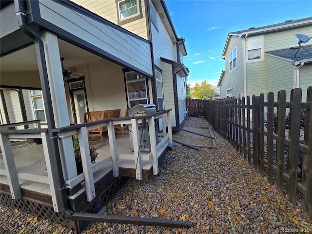 view of property exterior featuring a wooden deck