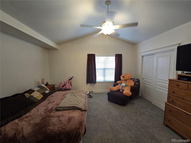 carpeted bedroom featuring ceiling fan, a closet, and vaulted ceiling