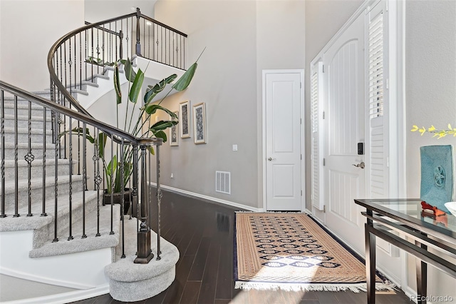 6728 S Catawba Way, Aurora, CO 80016 - entryway with wood finished floors, stairway, and a towering ceiling