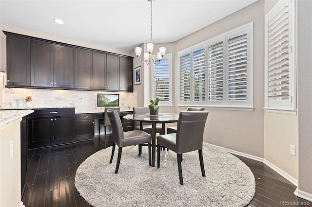 6728 S Catawba Way, Aurora, CO 80016 - dining room featuring dark wood-style floors and a chandelier