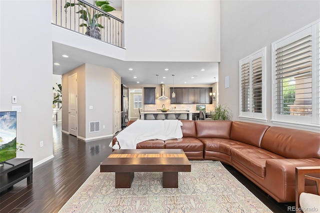 6728 S Catawba Way, Aurora, CO 80016 - living area with dark wood-type flooring and a towering ceiling