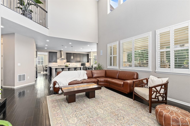 6728 S Catawba Way, Aurora, CO 80016 - living room featuring dark wood-type flooring and a towering ceiling