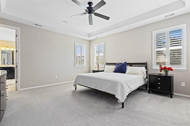 6728 S Catawba Way, Aurora, CO 80016 - bedroom with a tray ceiling, ornamental molding, light colored carpet, ceiling fan, and ensuite bathroom