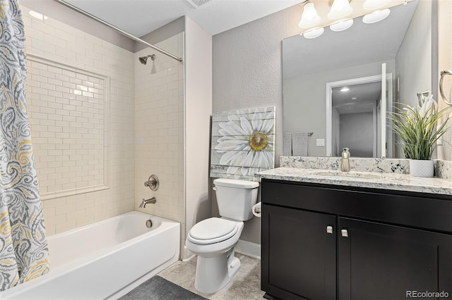 6728 S Catawba Way, Aurora, CO 80016 - bathroom with shower / bath combo, vanity, tile patterned floors, and a textured wall