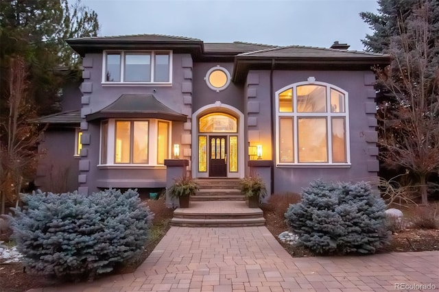 view of front of house featuring stucco siding