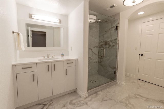 bathroom featuring vanity and walk in shower