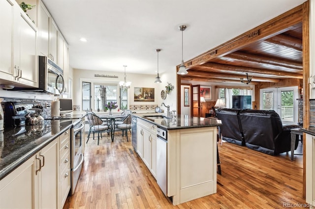 640 Pinewood Ln, Estes Park, CO 80517 - kitchen featuring stainless steel appliances, light wood finished floors, a sink, a chandelier, and recessed lighting