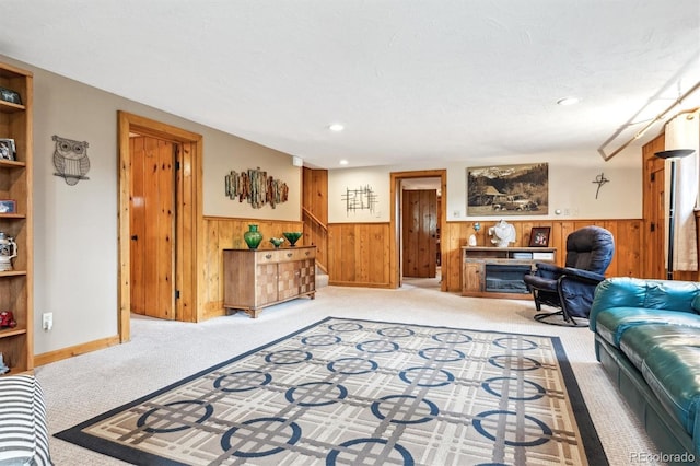640 Pinewood Ln, Estes Park, CO 80517 - living area with wainscoting, wooden walls, carpet, and stairway