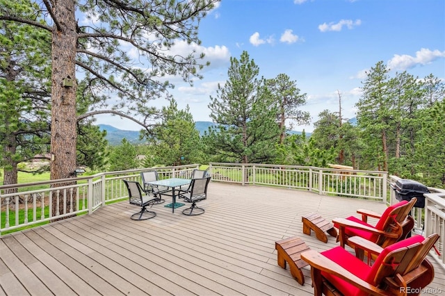 640 Pinewood Ln, Estes Park, CO 80517 - deck with outdoor dining space and a mountain view