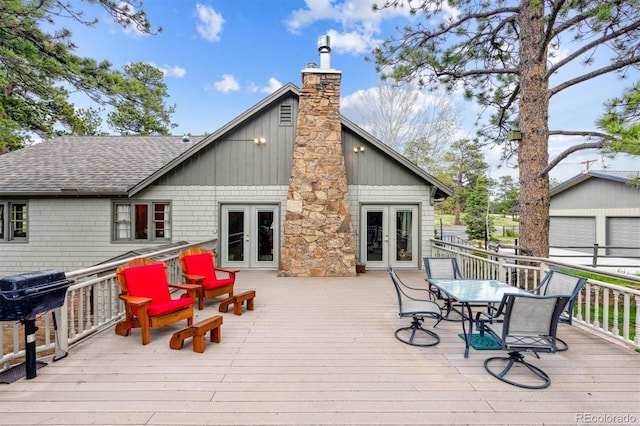 640 Pinewood Ln, Estes Park, CO 80517 - deck featuring french doors, outdoor dining space, and a grill