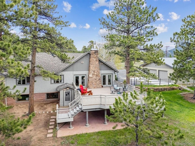 640 Pinewood Ln, Estes Park, CO 80517 - rear view of house featuring french doors, a shingled roof, a chimney, and a deck