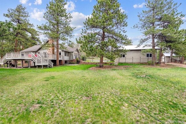 640 Pinewood Ln, Estes Park, CO 80517 - view of yard with stairway, a wooden deck, and an outbuilding