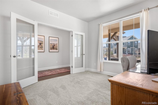home office with carpet flooring, baseboards, french doors, and visible vents