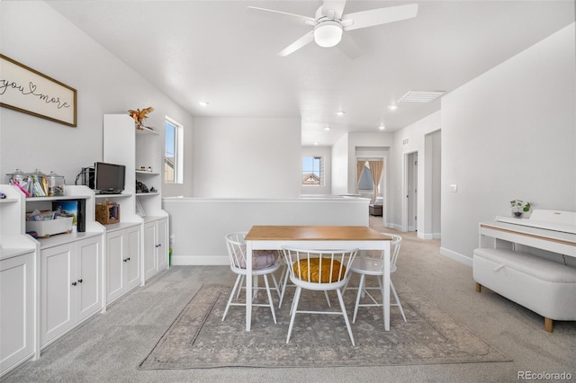 dining space with recessed lighting, light carpet, a ceiling fan, and baseboards