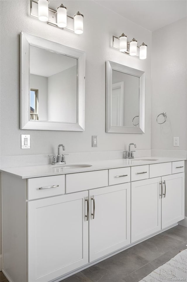 bathroom with double vanity and a sink