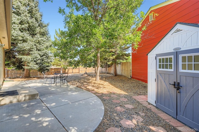17948 E Colgate Pl, Aurora, CO 80013 - fenced backyard with a patio, a storage shed, and outdoor dining area
