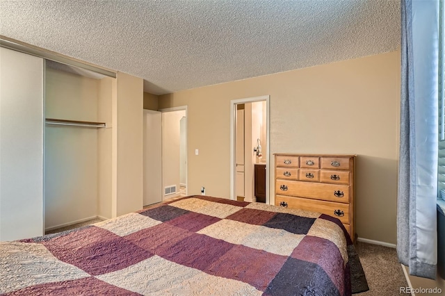 17948 E Colgate Pl, Aurora, CO 80013 - bedroom featuring a textured ceiling, carpet floors, and a closet