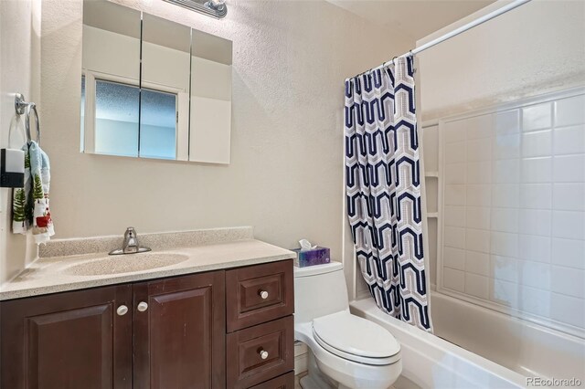 17948 E Colgate Pl, Aurora, CO 80013 - bathroom featuring vanity, shower / bath combo, and a textured wall