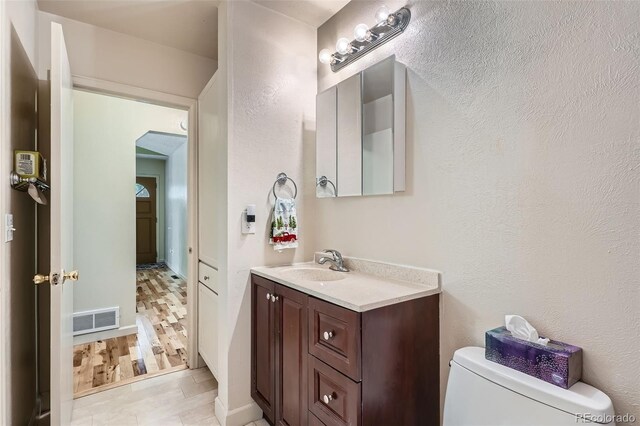17948 E Colgate Pl, Aurora, CO 80013 - half bath with vanity and a textured wall