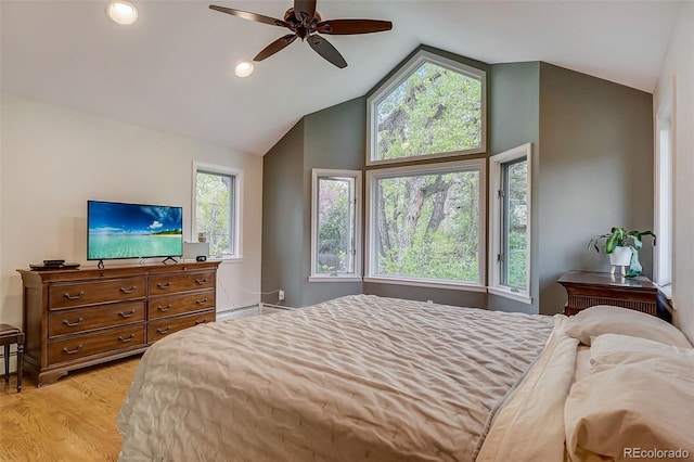 bedroom featuring high vaulted ceiling, light hardwood / wood-style floors, a baseboard radiator, and ceiling fan