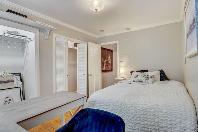 bedroom with crown molding and hardwood / wood-style flooring