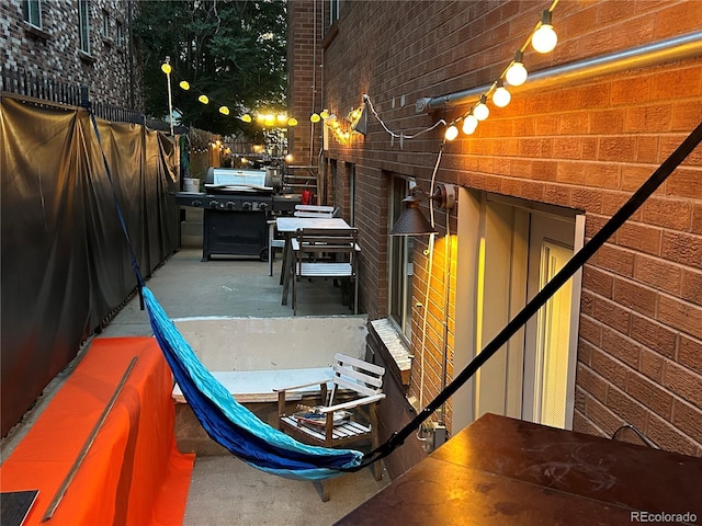 view of patio with fence and area for grilling