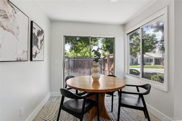 7970 Chase Cir Unit 85, Arvada, CO 80003 - dining room featuring plenty of natural light and wood finished floors