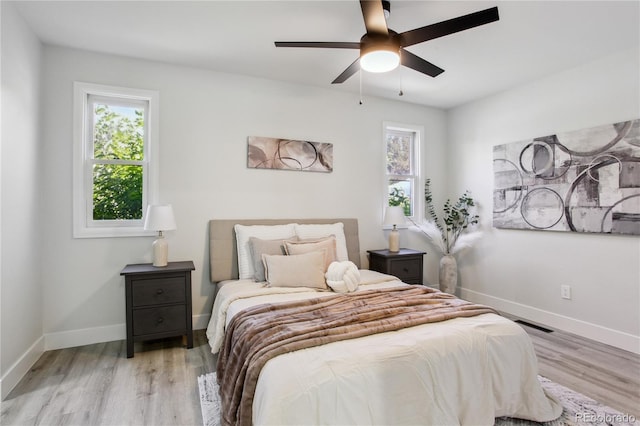 7970 Chase Cir Unit 85, Arvada, CO 80003 - bedroom with light wood-style floors and ceiling fan