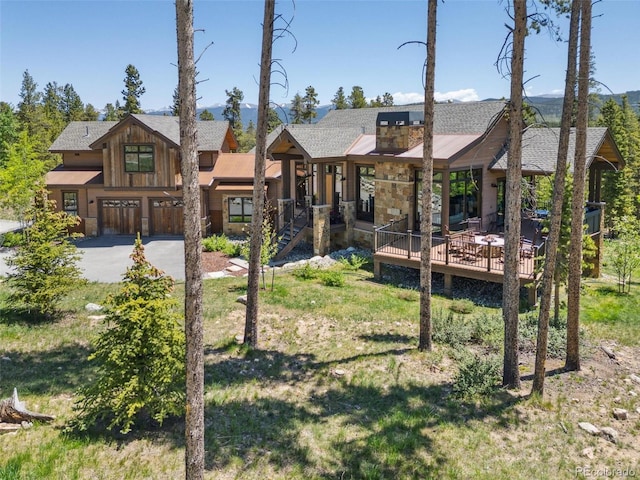 41 Barton Ridge Dr, Breckenridge, CO 80424 - view of front facade featuring a front lawn and a wooden deck