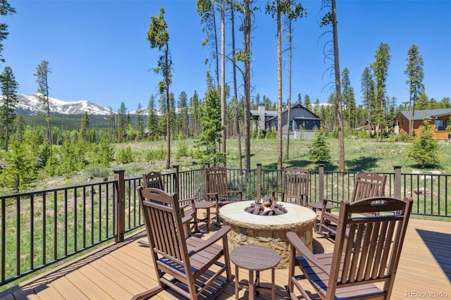41 Barton Ridge Dr, Breckenridge, CO 80424 - wooden terrace with an outdoor fire pit and a mountain view