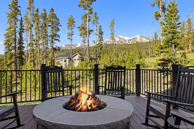 41 Barton Ridge Dr, Breckenridge, CO 80424 - wooden deck with a mountain view and a fire pit