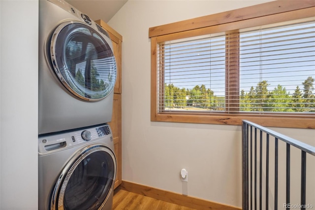 41 Barton Ridge Dr, Breckenridge, CO 80424 - washroom featuring stacked washing machine and dryer and light wood-type flooring