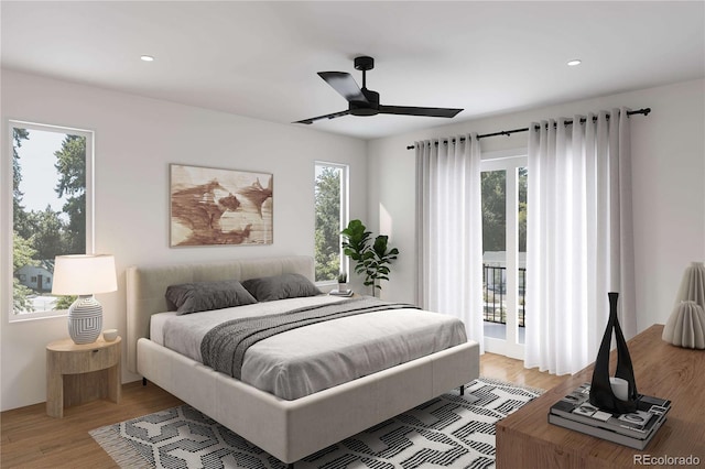 bedroom with light wood finished floors, multiple windows, recessed lighting, and access to outside