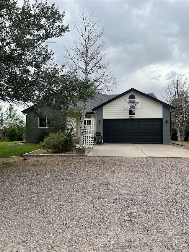 825 Cherokee St, Strasburg, CO 80136 - view of front facade featuring concrete driveway and an attached garage