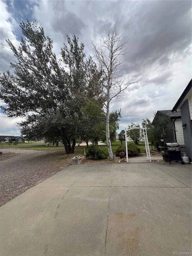 825 Cherokee St, Strasburg, CO 80136 - view of yard featuring a patio area