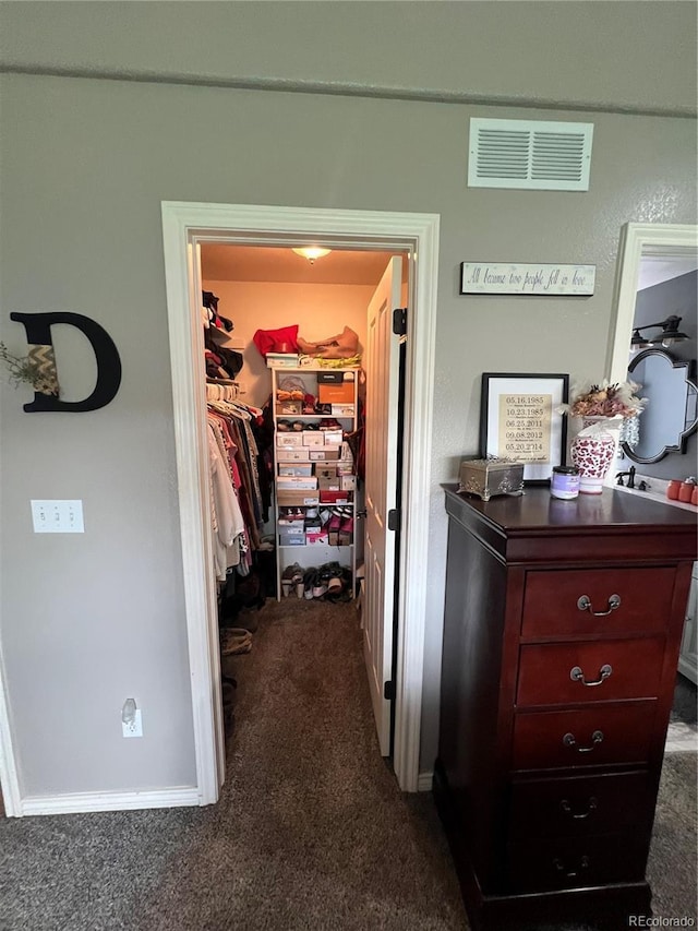 825 Cherokee St, Strasburg, CO 80136 - walk in closet featuring dark colored carpet