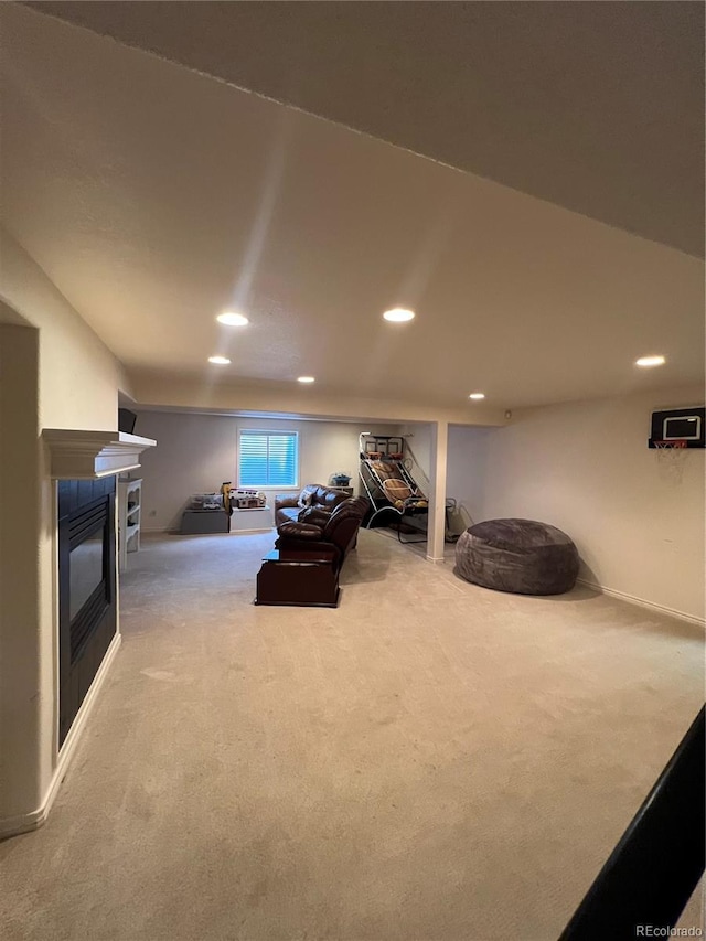 825 Cherokee St, Strasburg, CO 80136 - living room featuring carpet flooring, a glass covered fireplace, and recessed lighting