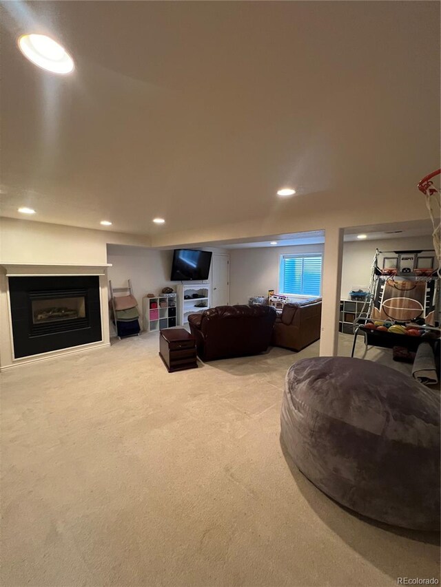 825 Cherokee St, Strasburg, CO 80136 - living room featuring a fireplace, recessed lighting, and carpet floors
