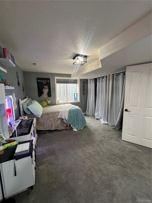 825 Cherokee St, Strasburg, CO 80136 - carpeted bedroom with a textured ceiling